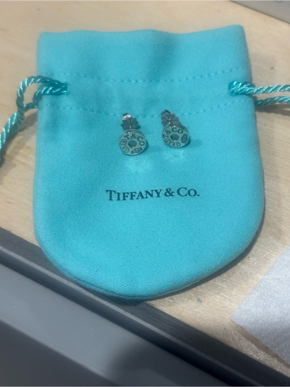 Tiffany & Co. Silver Round Logo Stud Earrings on Signature Blue Pouch